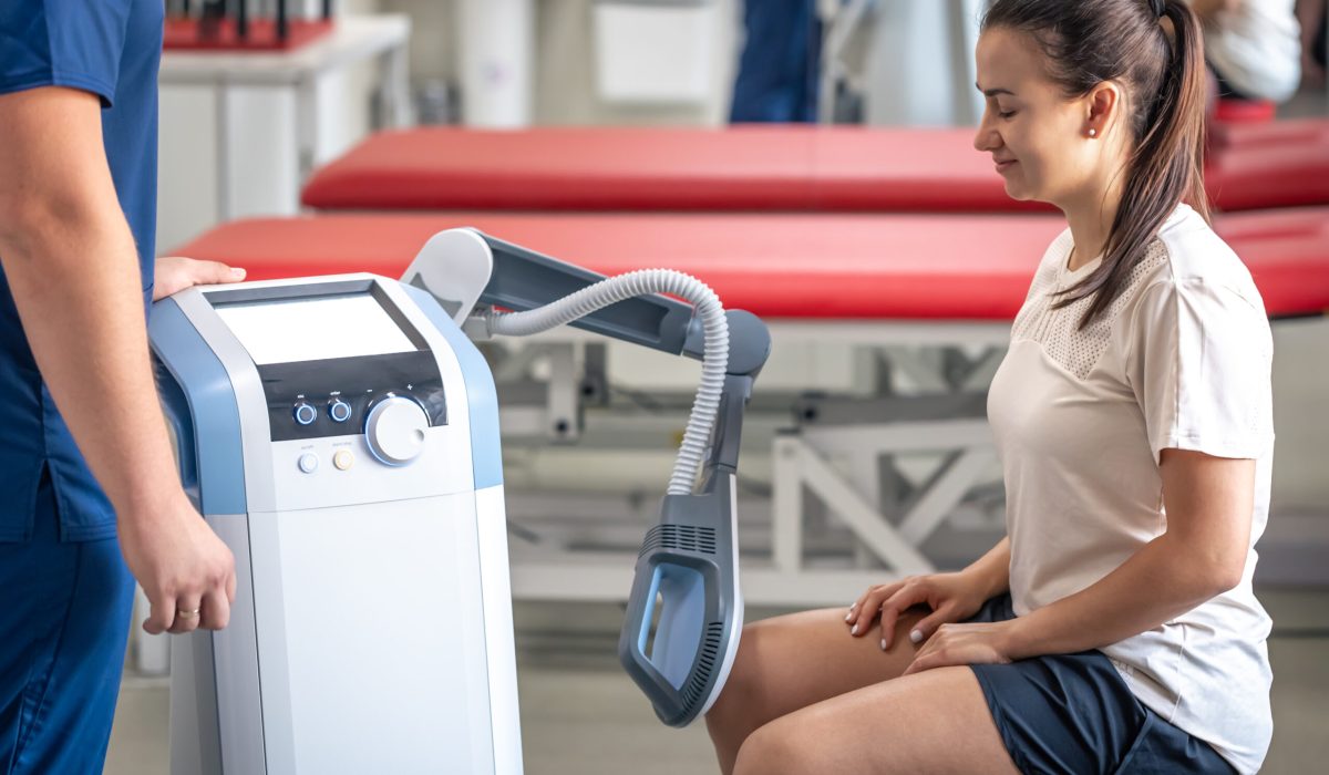 doctor using machine to treat the knee joints of a 2025 03 16 13 23 09 utc scaled